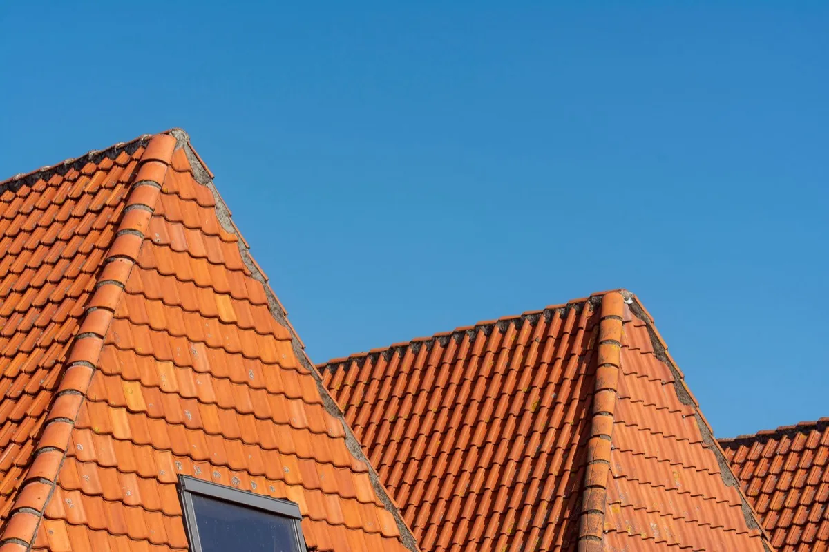Clay barrel tile rooflines on homes in Kokomo, IN