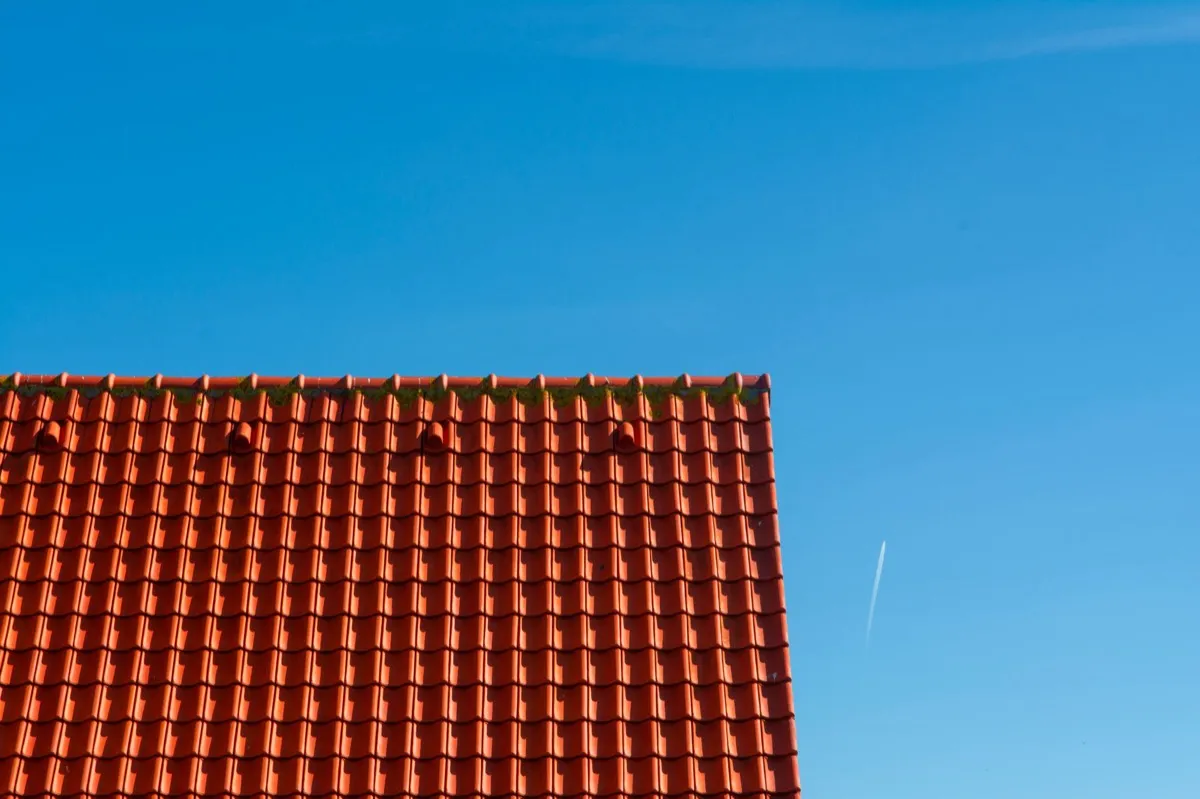 Tile roof gable in full sun, the kind of exposure that sets roof life in Kokomo, IN